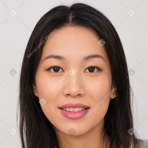 Joyful asian young-adult female with long  brown hair and brown eyes