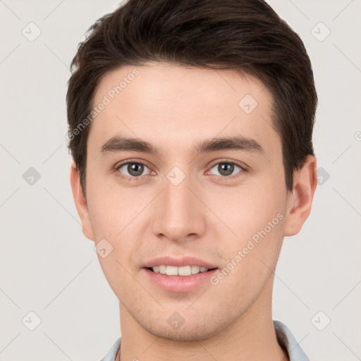 Joyful white young-adult male with short  brown hair and brown eyes