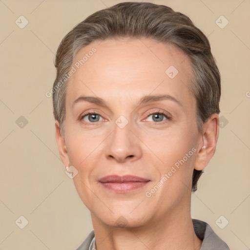 Joyful white adult female with short  brown hair and brown eyes