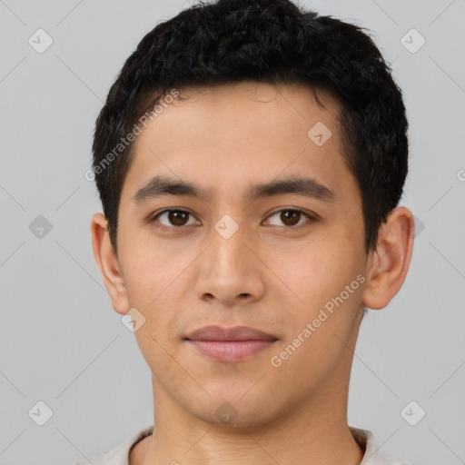 Joyful latino young-adult male with short  black hair and brown eyes