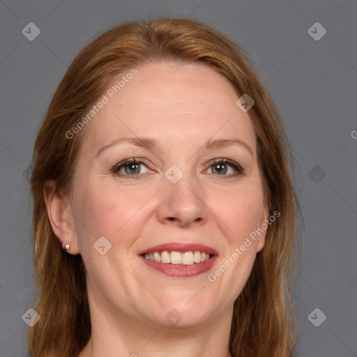 Joyful white adult female with medium  brown hair and grey eyes