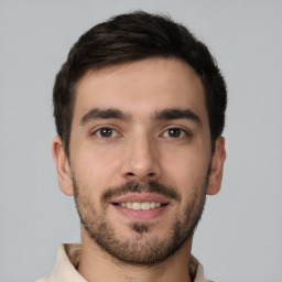 Joyful white young-adult male with short  brown hair and brown eyes