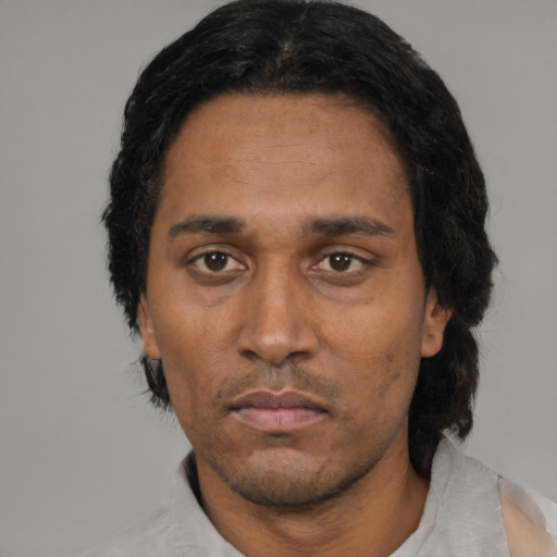 Neutral black adult male with short  black hair and brown eyes
