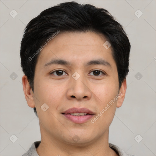 Joyful asian young-adult male with short  brown hair and brown eyes