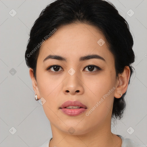 Joyful asian young-adult female with short  black hair and brown eyes