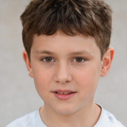 Joyful white child male with short  brown hair and brown eyes