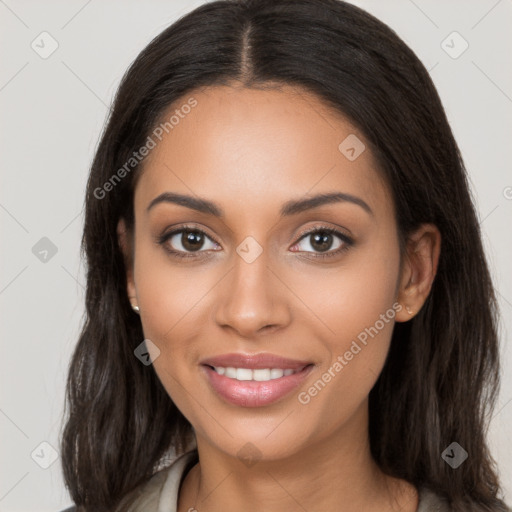 Joyful latino young-adult female with long  brown hair and brown eyes