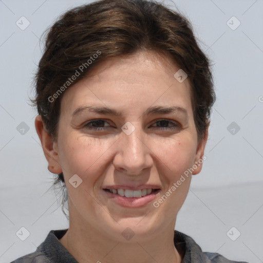 Joyful white adult female with short  brown hair and brown eyes