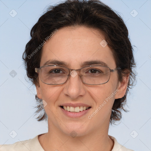 Joyful white adult female with short  brown hair and brown eyes