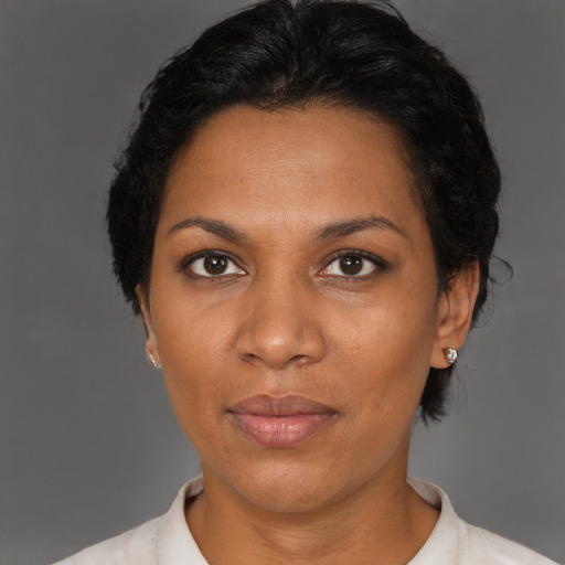 Neutral black adult female with short  black hair and brown eyes