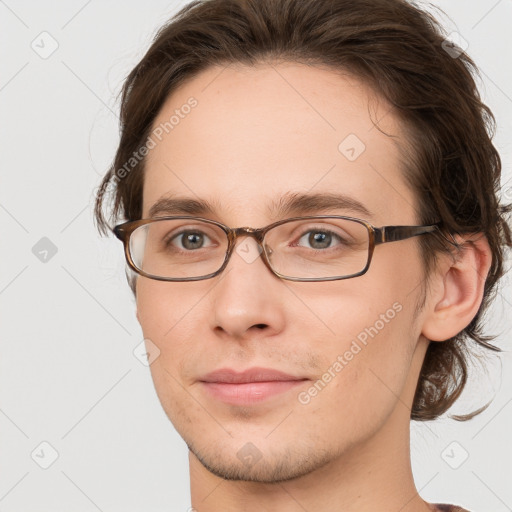 Joyful white young-adult male with medium  brown hair and brown eyes