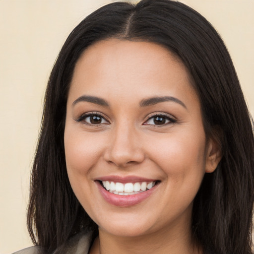 Joyful white young-adult female with long  brown hair and brown eyes