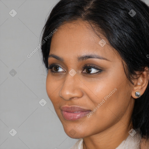 Joyful latino young-adult female with medium  black hair and brown eyes