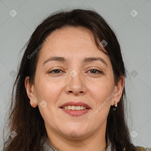 Joyful white adult female with medium  brown hair and brown eyes