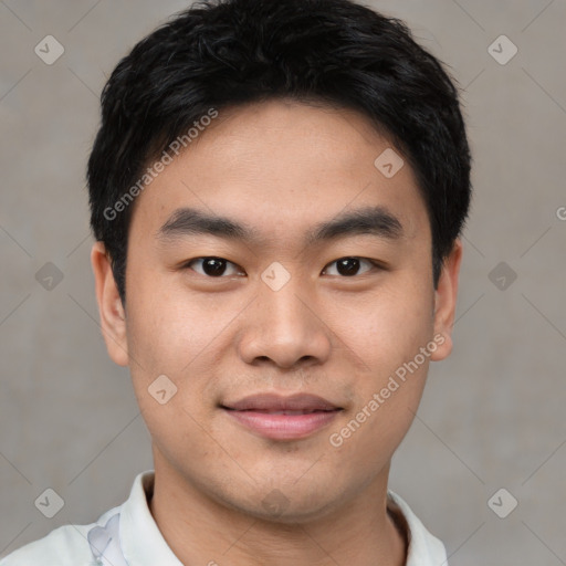 Joyful asian young-adult male with short  black hair and brown eyes