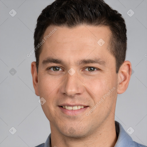 Joyful white young-adult male with short  brown hair and grey eyes