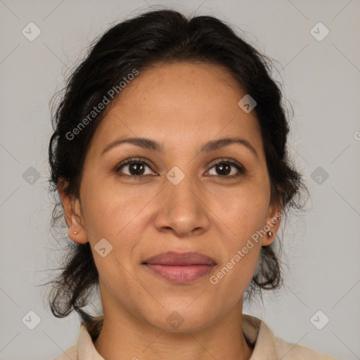 Joyful latino adult female with medium  brown hair and brown eyes