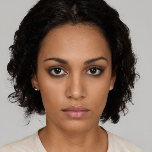 Neutral black young-adult female with medium  black hair and brown eyes