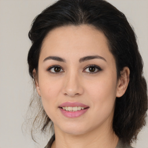 Joyful white young-adult female with medium  brown hair and brown eyes