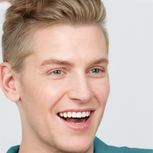 Joyful white young-adult male with short  brown hair and blue eyes