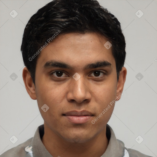 Joyful latino young-adult male with short  black hair and brown eyes