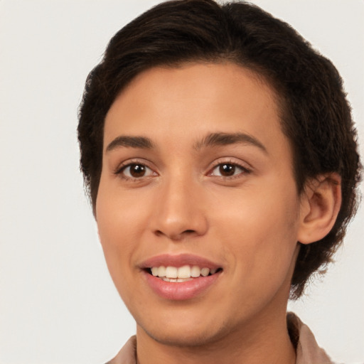 Joyful white young-adult female with short  brown hair and brown eyes