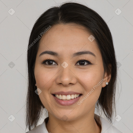 Joyful asian young-adult female with medium  brown hair and brown eyes