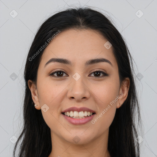 Joyful latino young-adult female with long  brown hair and brown eyes