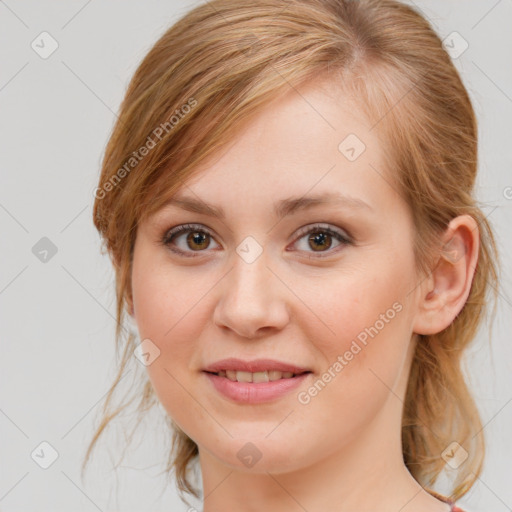 Joyful white young-adult female with medium  brown hair and blue eyes