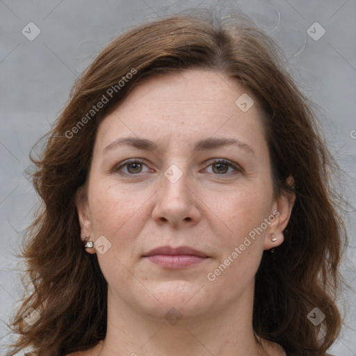 Joyful white adult female with medium  brown hair and grey eyes