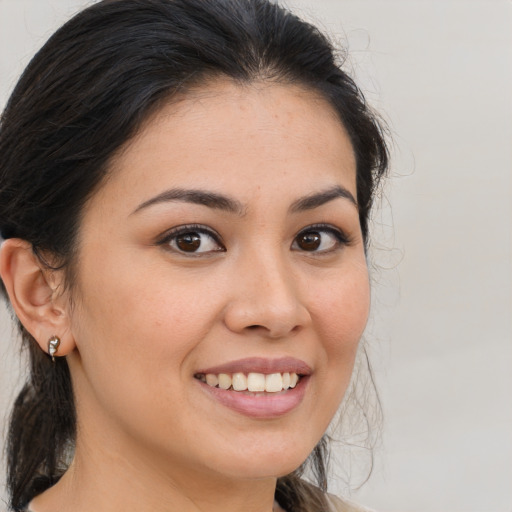 Joyful white young-adult female with medium  brown hair and brown eyes