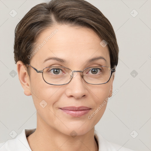 Joyful white adult female with short  brown hair and brown eyes