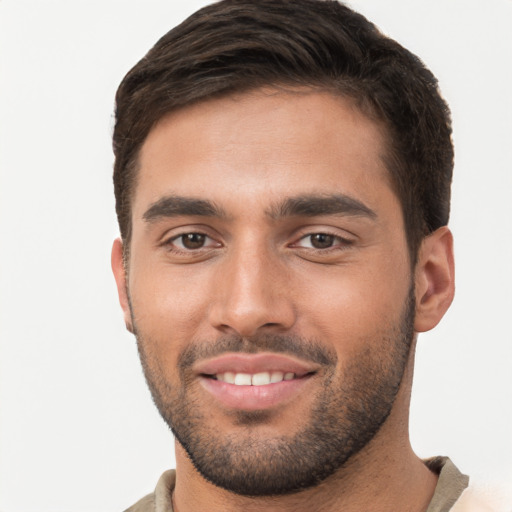 Joyful white young-adult male with short  brown hair and brown eyes