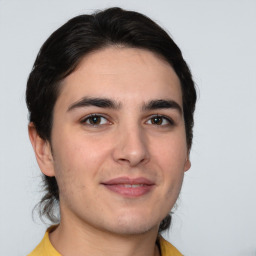 Joyful white young-adult male with medium  brown hair and brown eyes