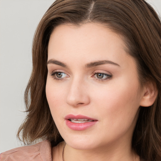 Neutral white young-adult female with long  brown hair and brown eyes