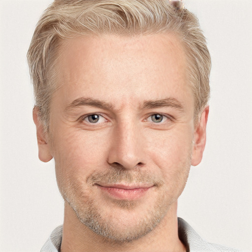 Joyful white adult male with short  brown hair and grey eyes