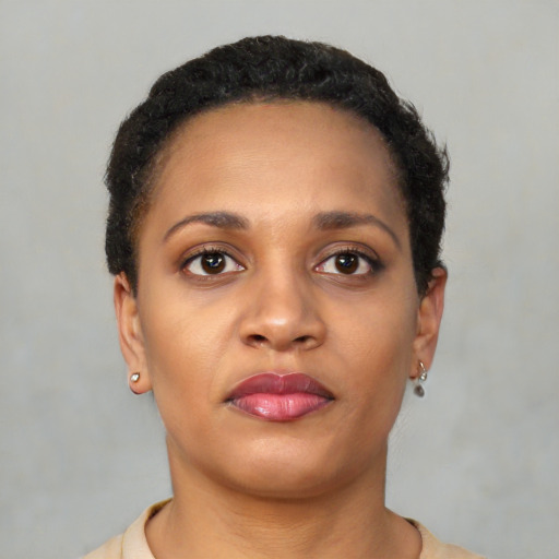 Neutral latino young-adult female with short  brown hair and brown eyes