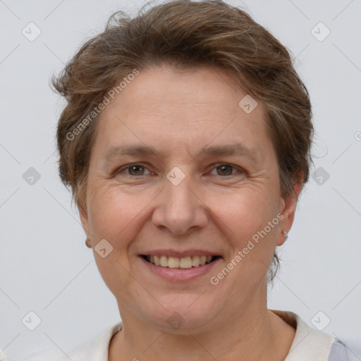 Joyful white adult female with short  brown hair and brown eyes