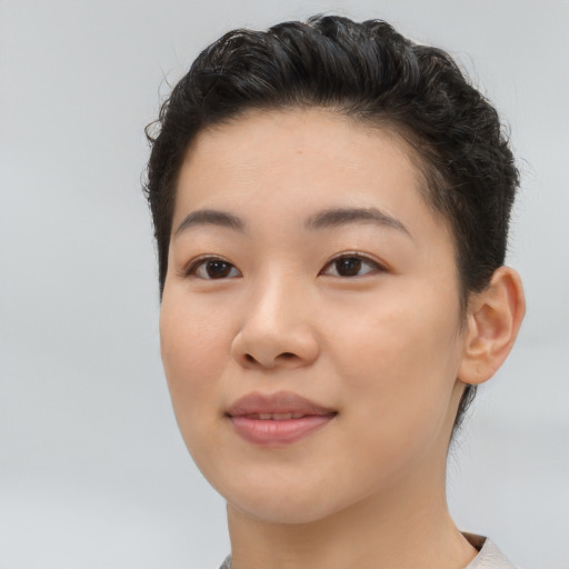 Joyful asian young-adult female with short  brown hair and brown eyes