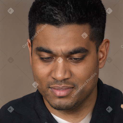 Joyful black young-adult male with short  brown hair and brown eyes