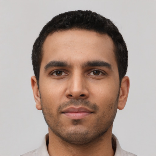 Neutral latino young-adult male with short  black hair and brown eyes
