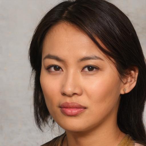 Neutral asian young-adult female with medium  brown hair and brown eyes