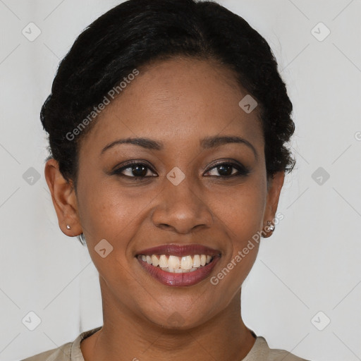 Joyful black young-adult female with short  brown hair and brown eyes