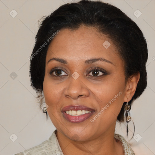 Joyful black adult female with medium  brown hair and brown eyes