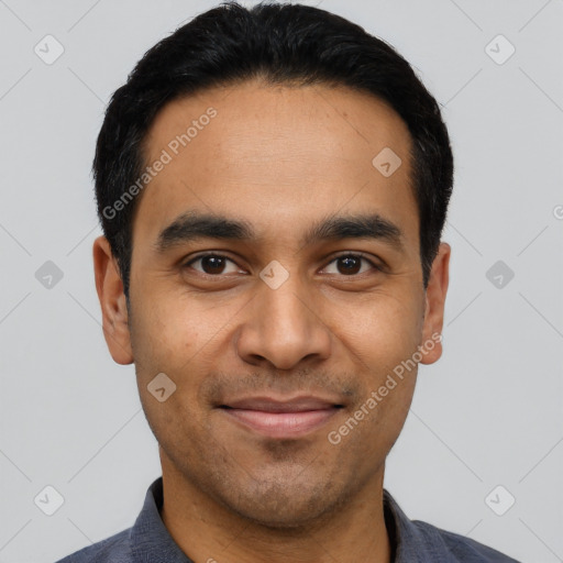 Joyful latino young-adult male with short  black hair and brown eyes