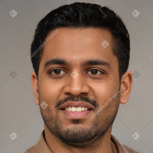 Joyful black young-adult male with short  black hair and brown eyes