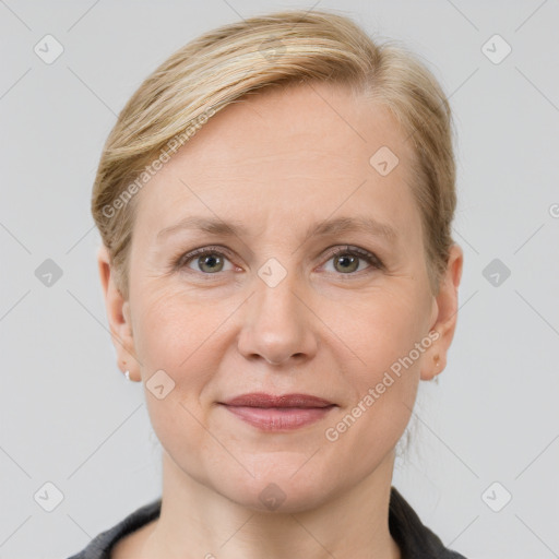 Joyful white adult female with short  brown hair and grey eyes