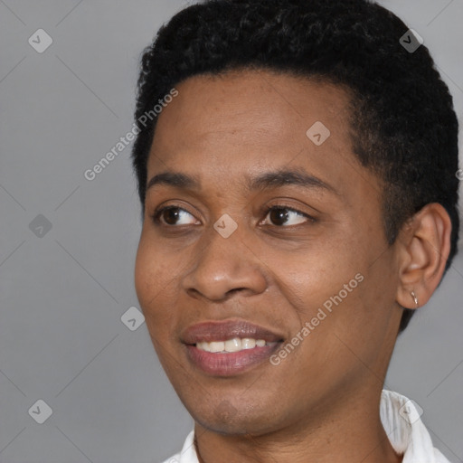 Joyful black young-adult male with short  black hair and brown eyes