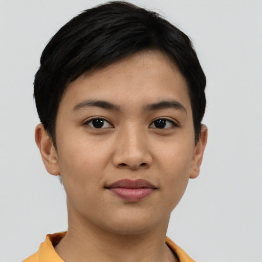 Joyful latino young-adult female with short  brown hair and brown eyes