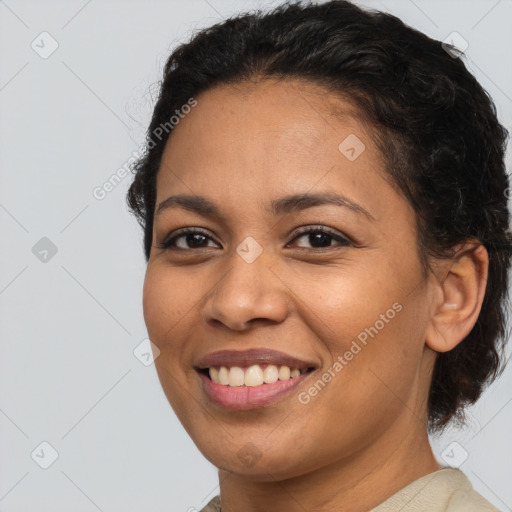 Joyful latino young-adult female with short  brown hair and brown eyes